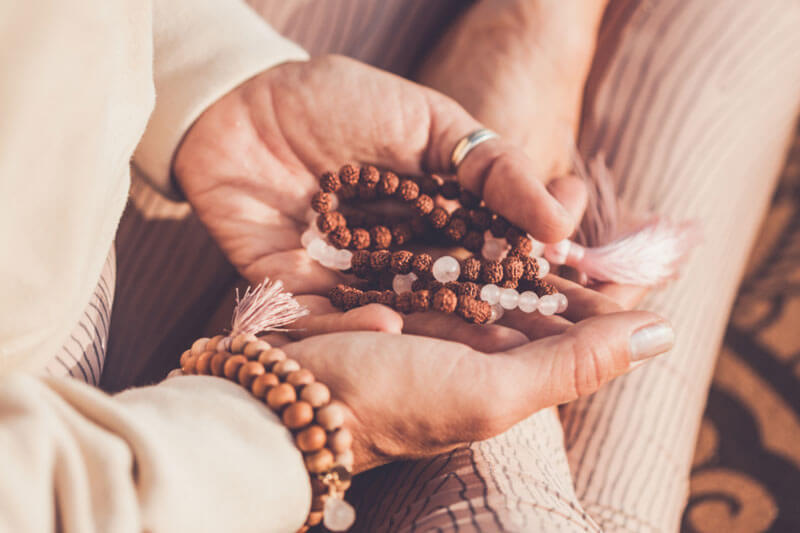 Gifts of comfort for those who are grieving or have experienced another traumatic event include mala beads, shown here. Caption: Mala beads can enhance prayer and meditation.