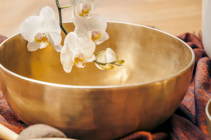 Gifts of comfort for the holidays for those who are struggling include singing bowls, as depicted here. Singing bowls produce soothing sounds and vibrations.